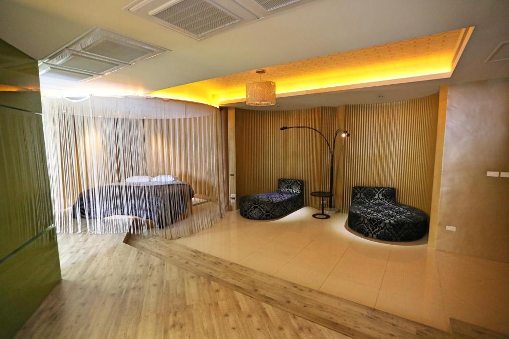 Postel nebo postele na pokoji v ubytování Zhen 13 Villa Motel