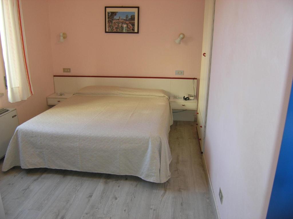 Postel nebo postele na pokoji v ubytování Elba Hotel