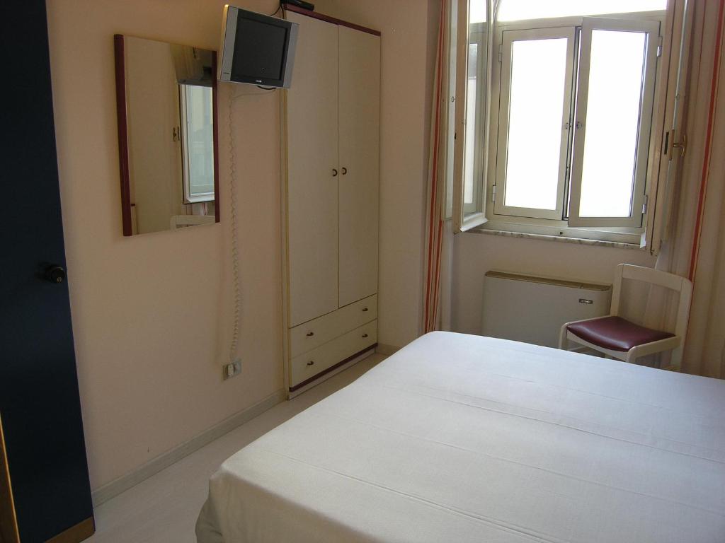 Postel nebo postele na pokoji v ubytování Elba Hotel