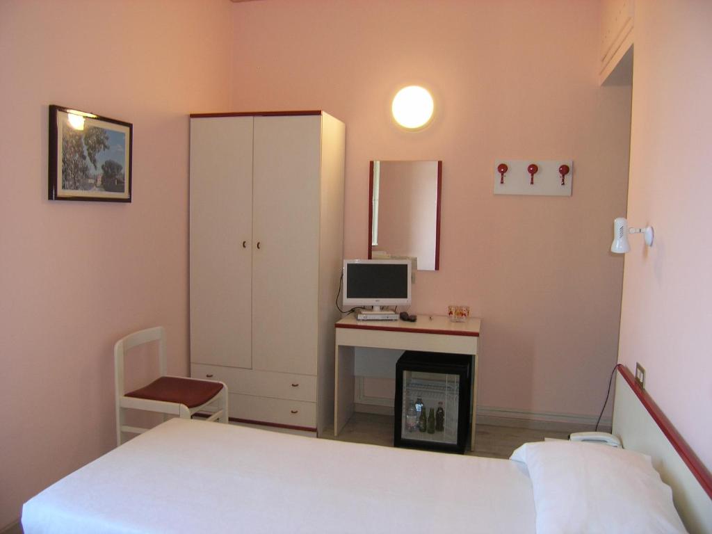 Postel nebo postele na pokoji v ubytování Elba Hotel