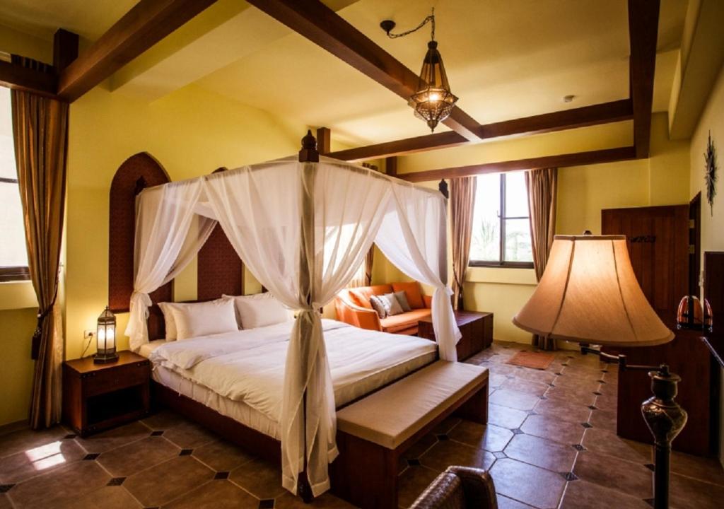 Postel nebo postele na pokoji v ubytování Oasis Hotel