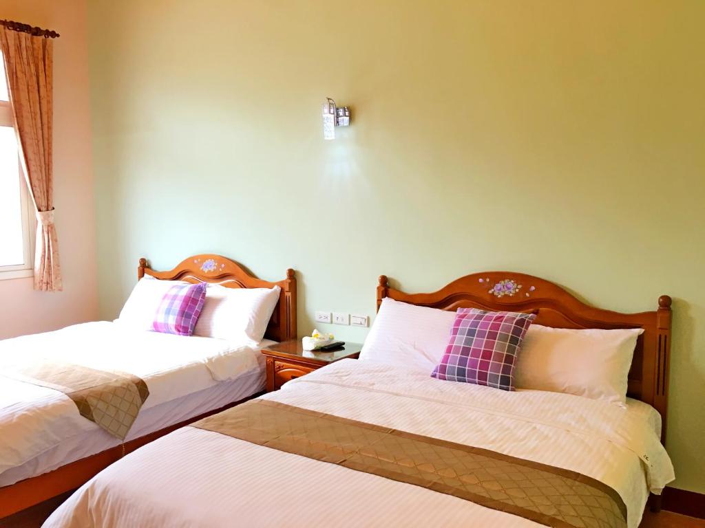 Postel nebo postele na pokoji v ubytování Jiang Shui Village B&B