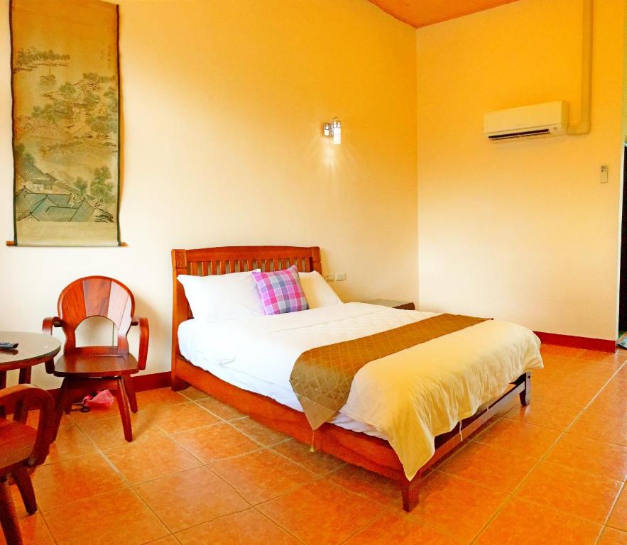 Postel nebo postele na pokoji v ubytování Jiang Shui Village B&B