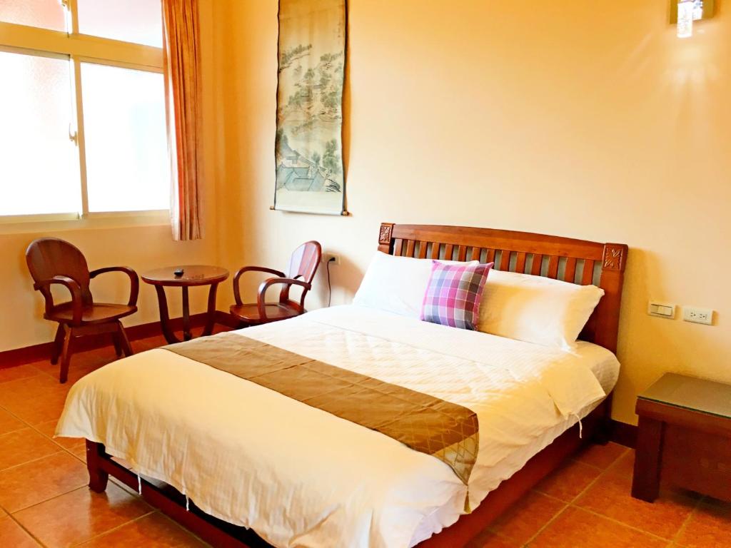 Postel nebo postele na pokoji v ubytování Jiang Shui Village B&B