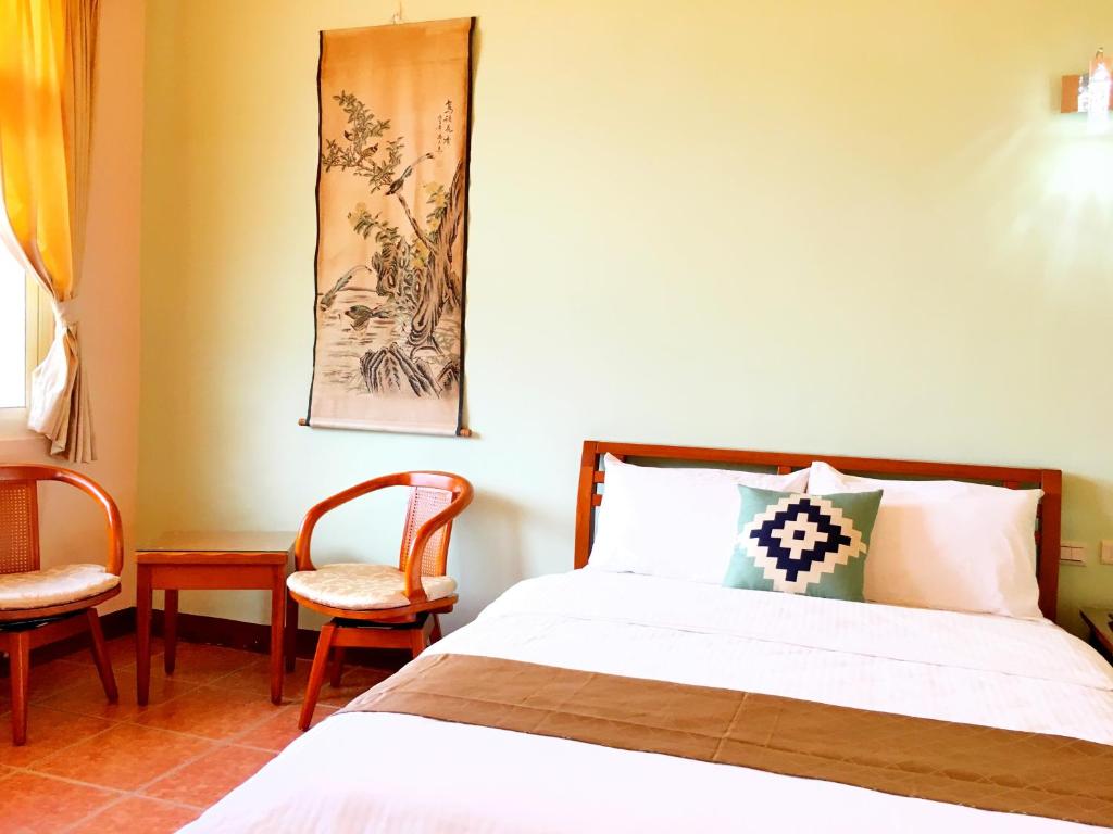 Postel nebo postele na pokoji v ubytování Jiang Shui Village B&B