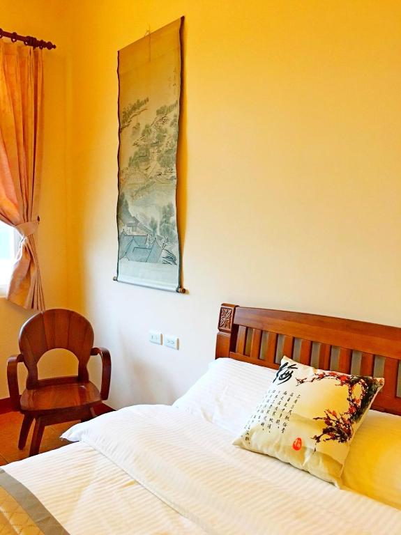 Postel nebo postele na pokoji v ubytování Jiang Shui Village B&B