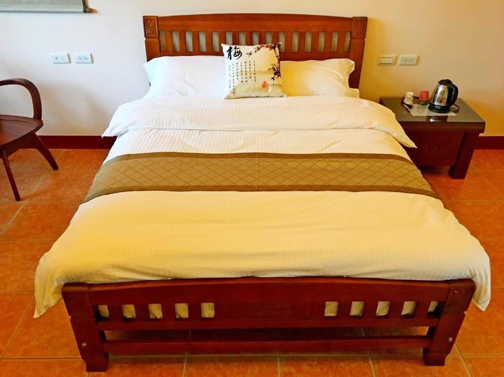 Postel nebo postele na pokoji v ubytování Jiang Shui Village B&B