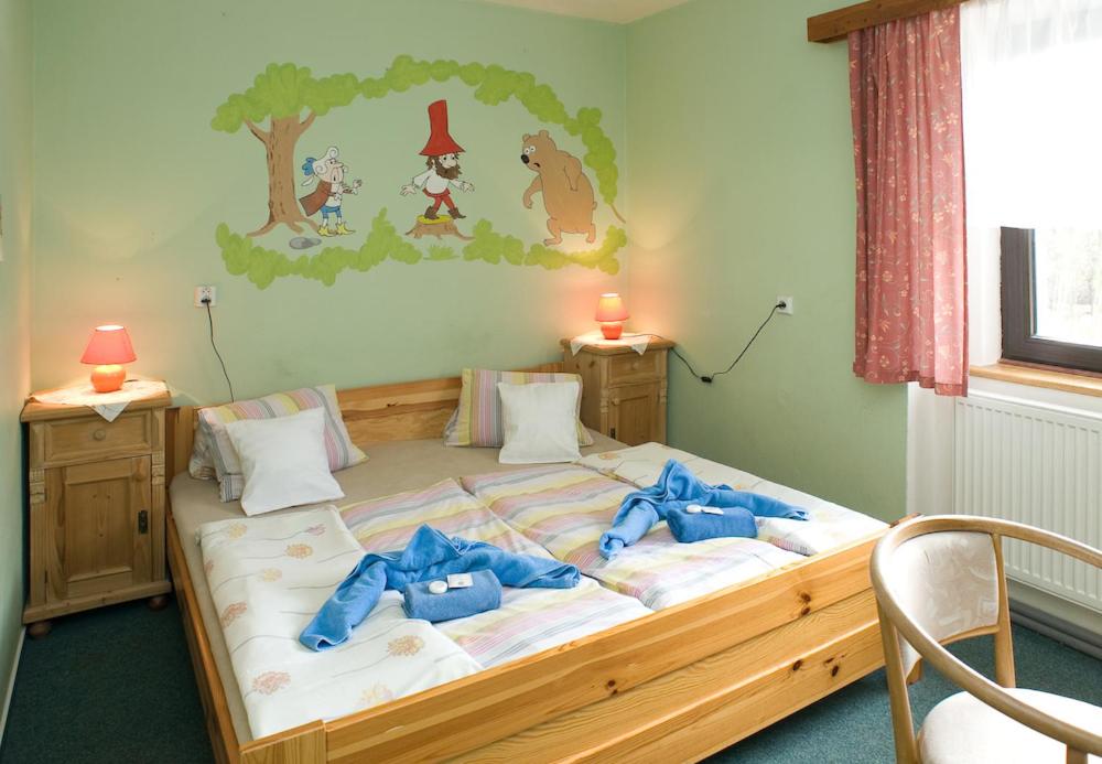 Ein Bett oder Betten in einem Zimmer der Unterkunft Borovansky mlyn