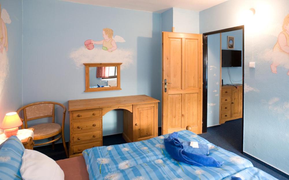 Ein Bett oder Betten in einem Zimmer der Unterkunft Borovansky mlyn