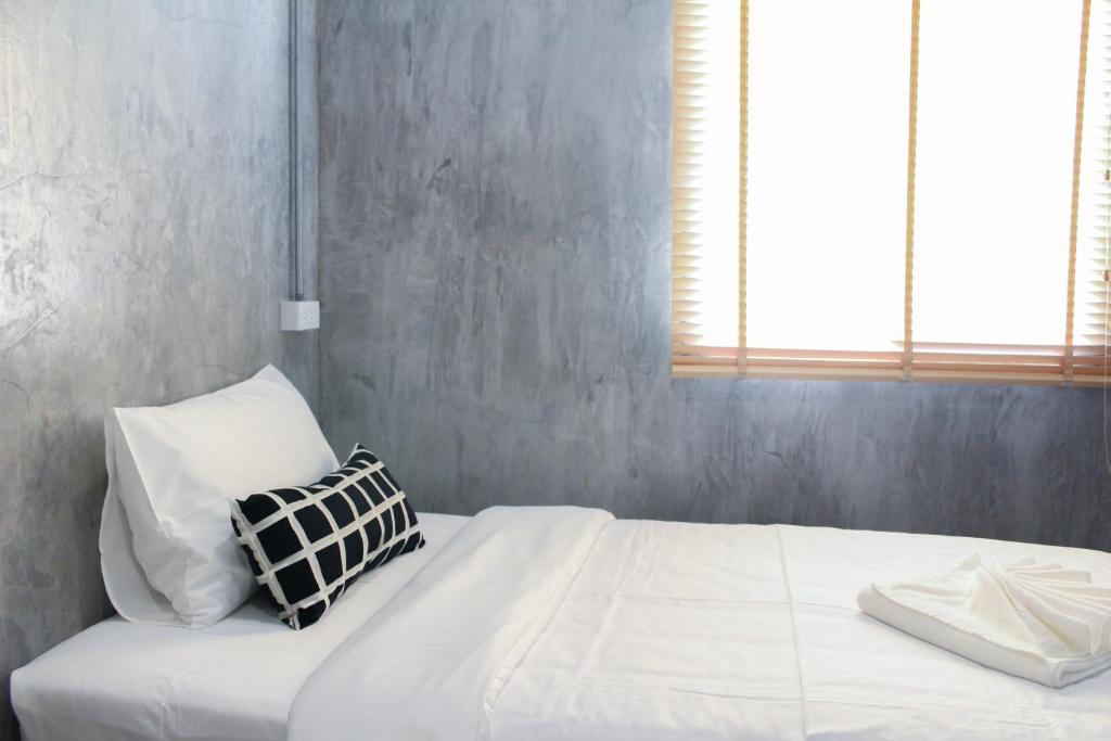 Postel nebo postele na pokoji v ubytování The Simple Koh Yao Noi