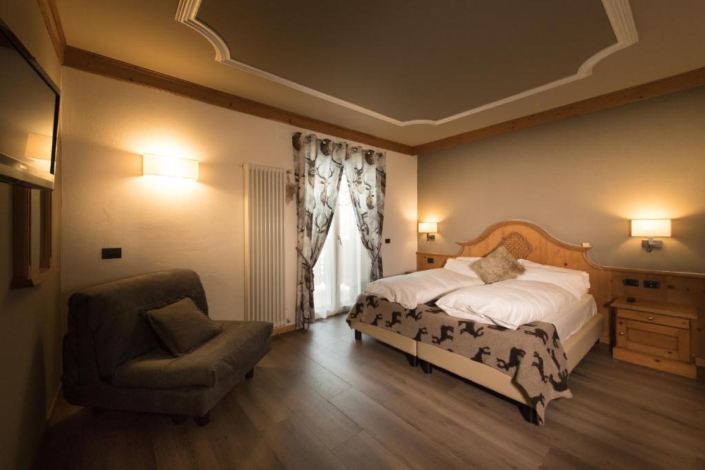 Postel nebo postele na pokoji v ubytování Hotel Patrizia Dolomites Glamour