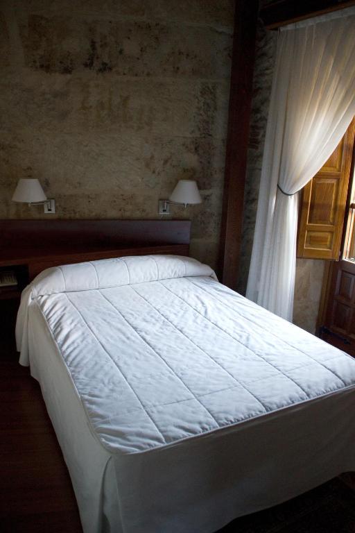 Postel nebo postele na pokoji v ubytování Hotel Microtel Placentinos