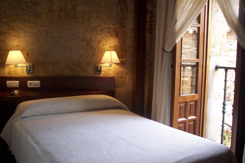 Postel nebo postele na pokoji v ubytování Hotel Microtel Placentinos