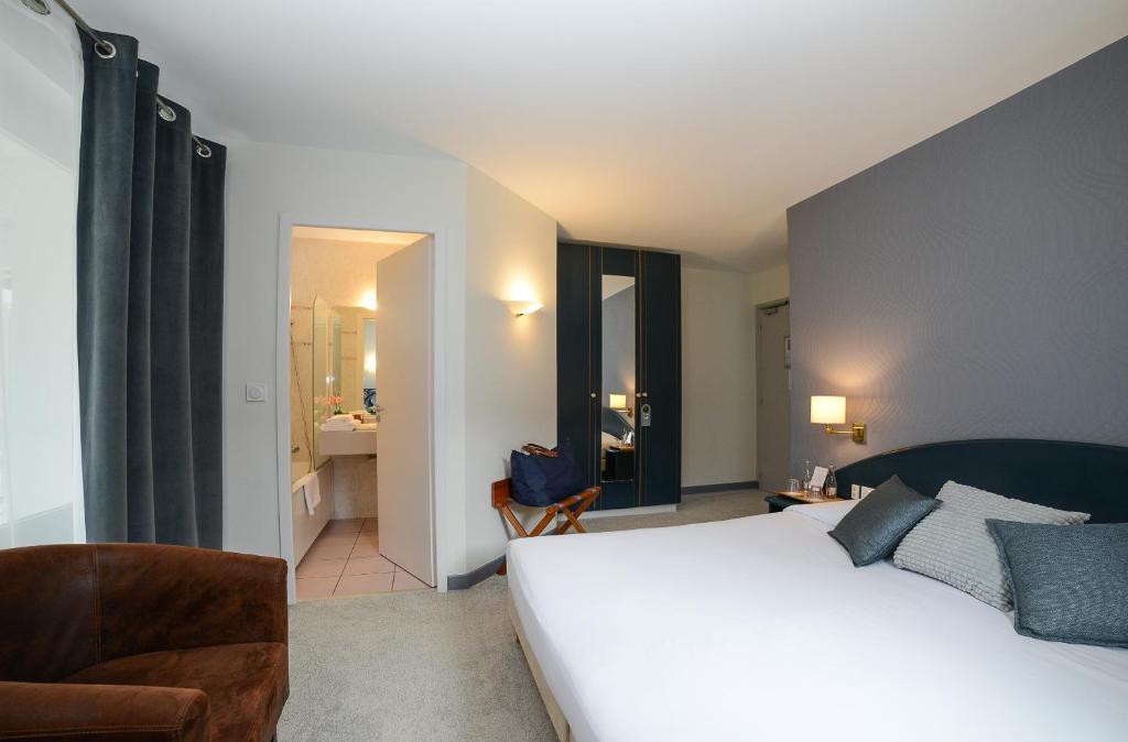Cama o camas de una habitación en Novalaise Plage