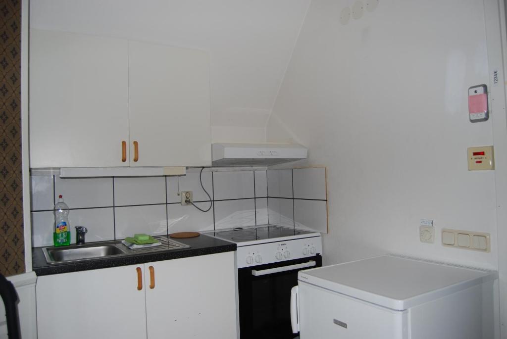 Kuchyň nebo kuchyňský kout v ubytování Halmstad Hotell & Vandrarhem Kaptenshamn
