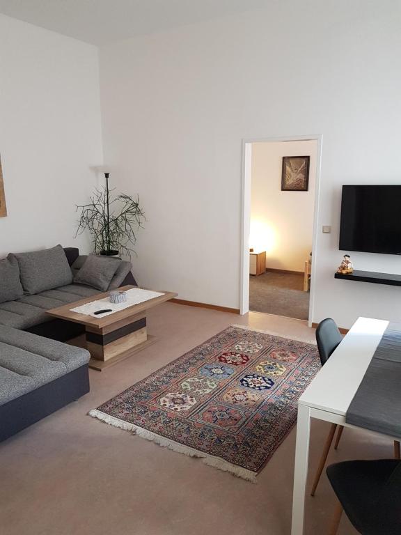 a living room with a couch and a tv at Gerald`s Apartment 10 in Vienna