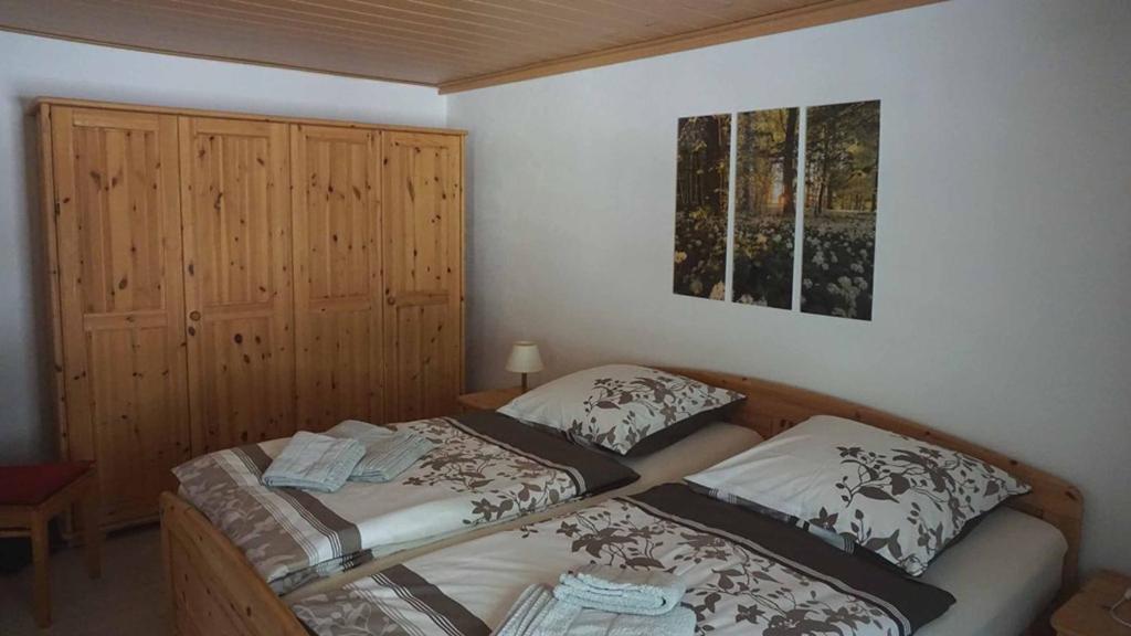 Postel nebo postele na pokoji v ubytování s'Heisl em Woid