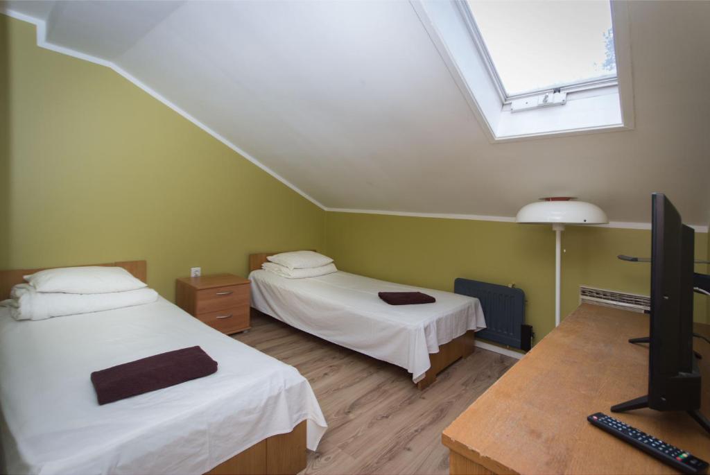 Postel nebo postele na pokoji v ubytování Peoleo Hotell