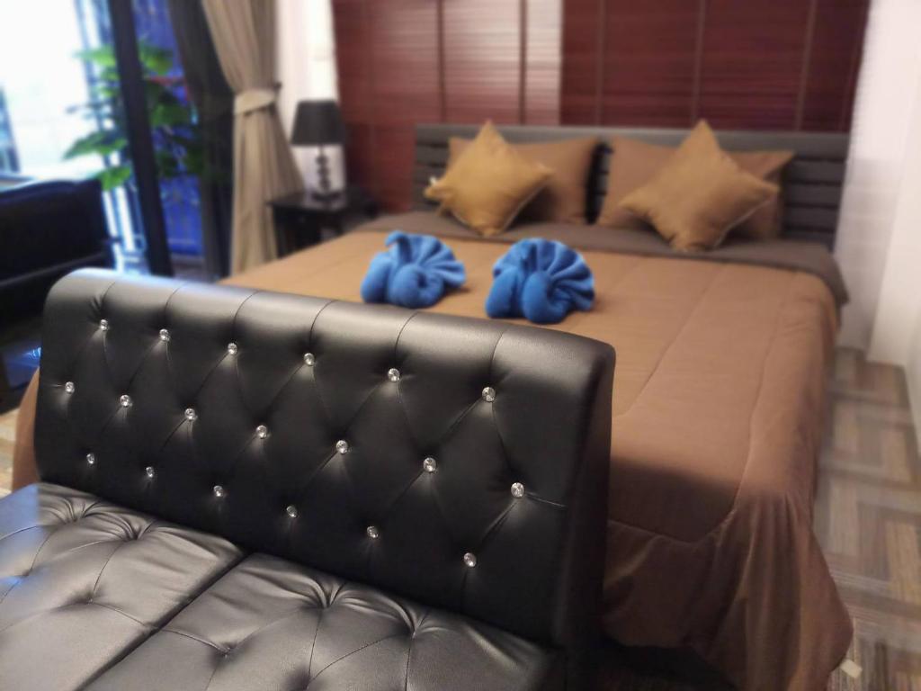 Una cama o camas en una habitación de Parawee Resort