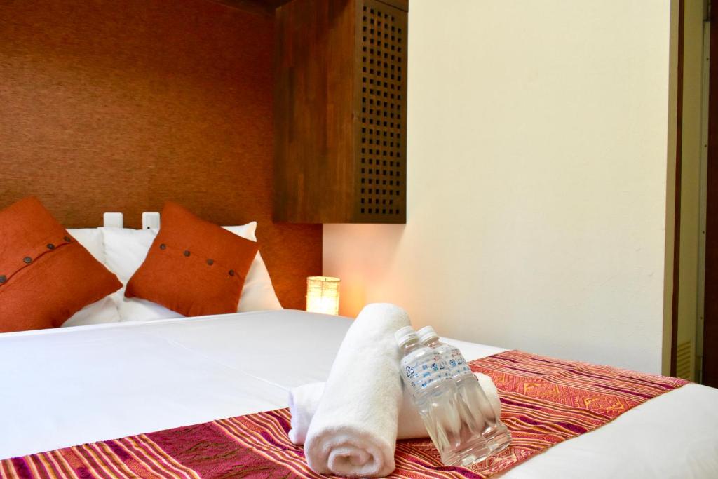 Uma cama ou camas num quarto em Mojo Lodge Hakuba