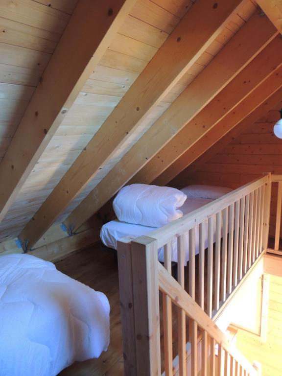 A bed or beds in a room at Càmping l'Alguer