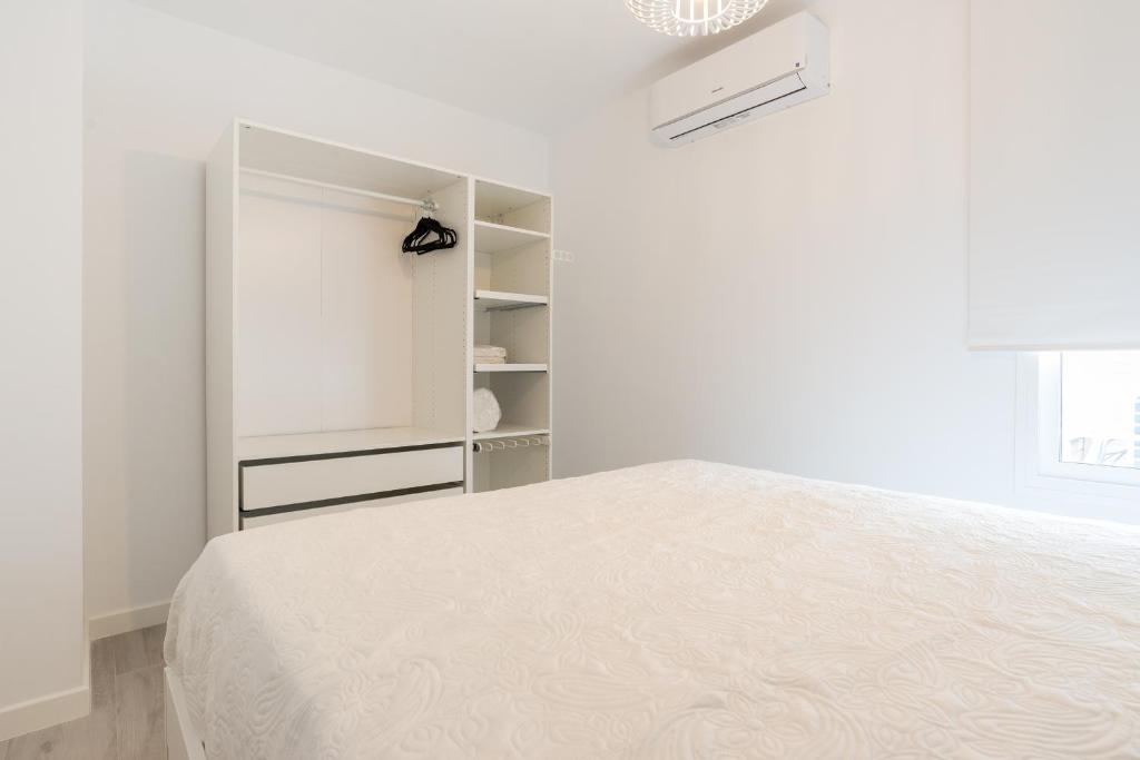 Posteľ alebo postele v izbe v ubytovaní MalagaSuite Premium Deluxe Alameda