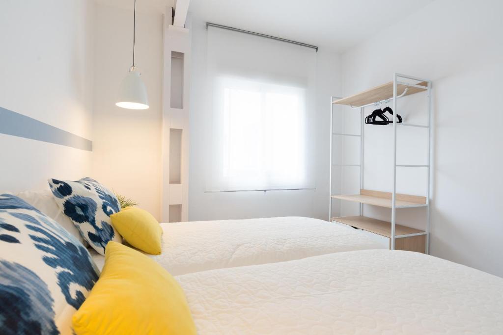 Posteľ alebo postele v izbe v ubytovaní MalagaSuite Premium Deluxe Alameda