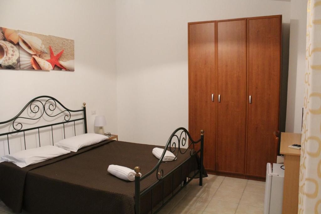 Postel nebo postele na pokoji v ubytování Affittacamere la Medusa