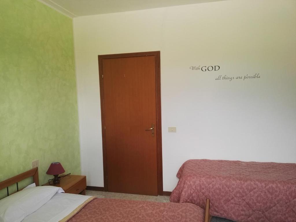 Postel nebo postele na pokoji v ubytování Camere Carloni