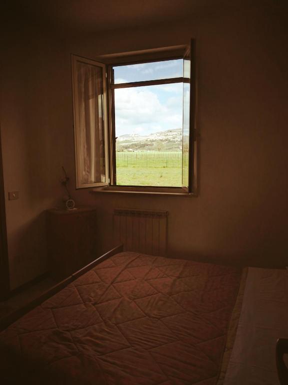 Postel nebo postele na pokoji v ubytování Camere Carloni