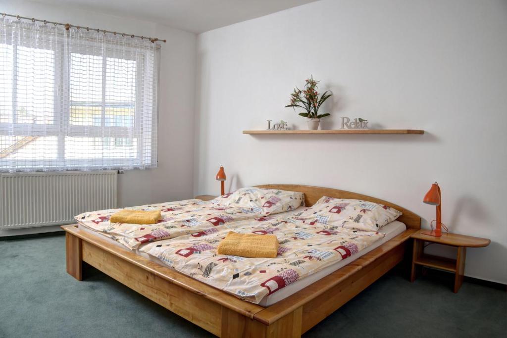 Postel nebo postele na pokoji v ubytování Vila Dům Evropa