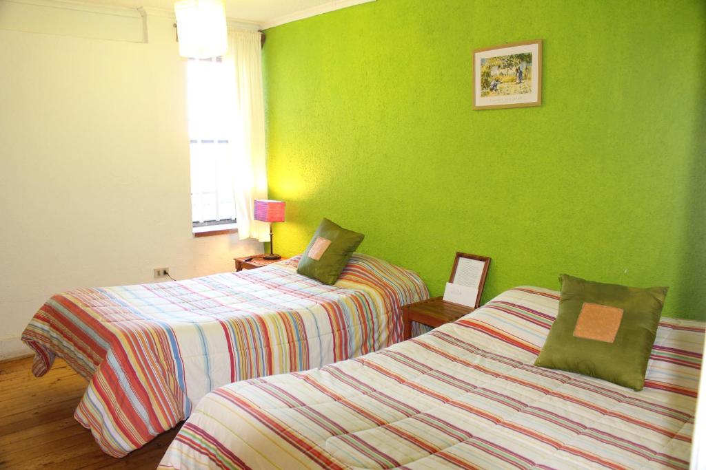 Postel nebo postele na pokoji v ubytování Cabañas, Habitaciones y Restaurant Montemar
