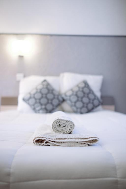 Postel nebo postele na pokoji v ubytování Hôtel Pedussaut