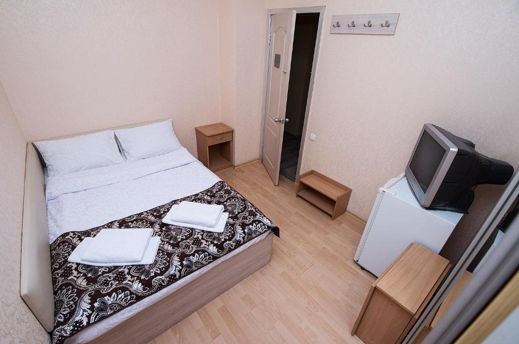 Postel nebo postele na pokoji v ubytování HOTEL ЗiРКА