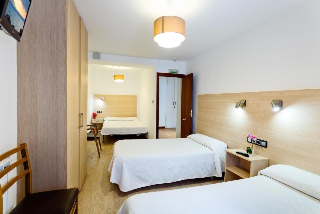 Postel nebo postele na pokoji v ubytování Casa OTANO