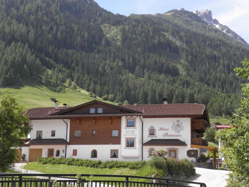 a building in front of a mountain at Haus Pinnistor in Neustift im Stubaital
