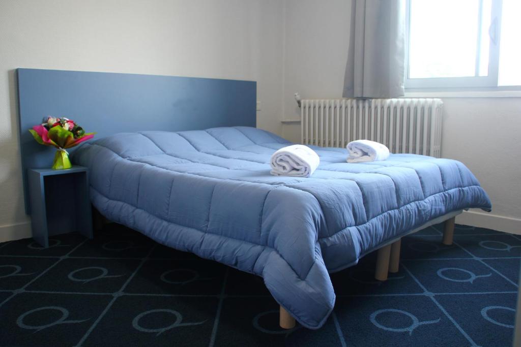Postel nebo postele na pokoji v ubytování Le Petit Majestic