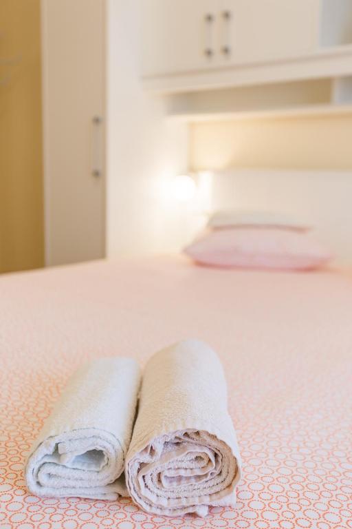 Postel nebo postele na pokoji v ubytování Apartments Contessa