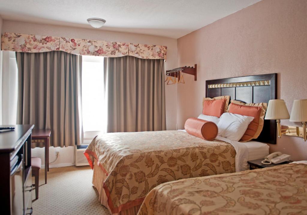a hotel room with two beds and a window at Harborview Inn & Suites-Convention Center-Airport-Gaslamp-Seaworld-Zoo-Balboa Park in San Diego