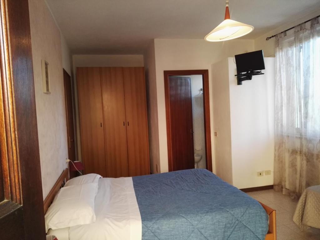 Postel nebo postele na pokoji v ubytování Camere Carloni