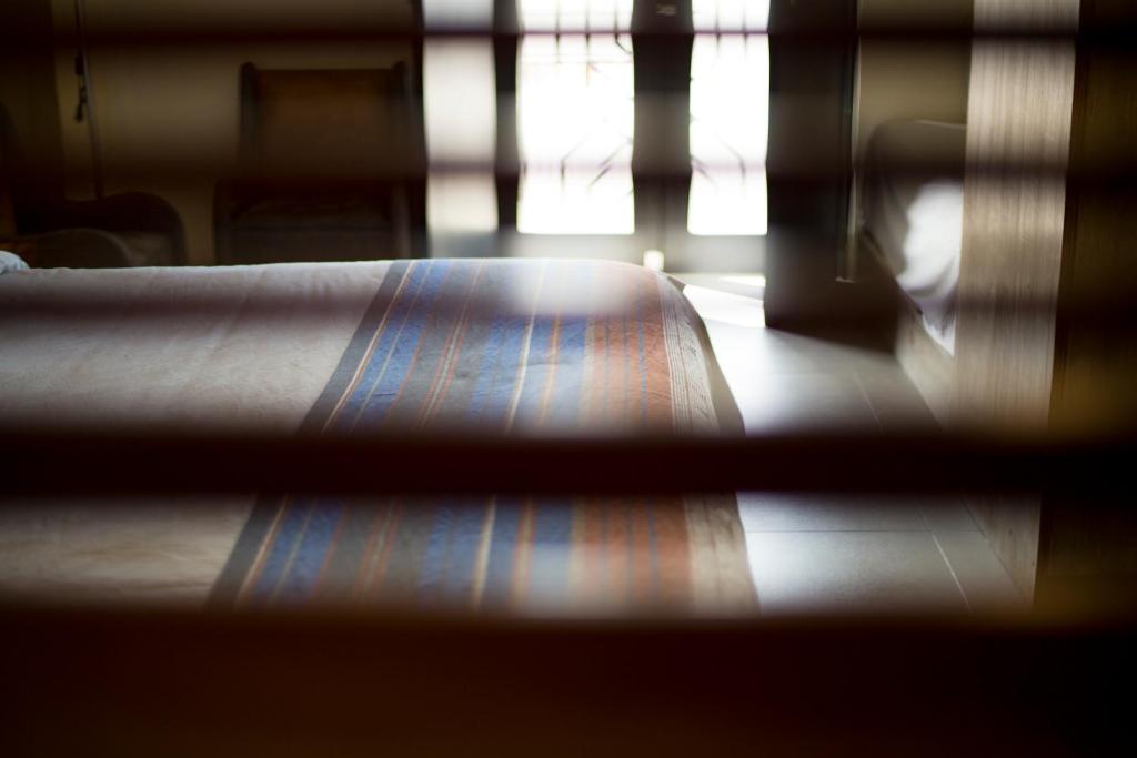 Postel nebo postele na pokoji v ubytování Hotel Helverica
