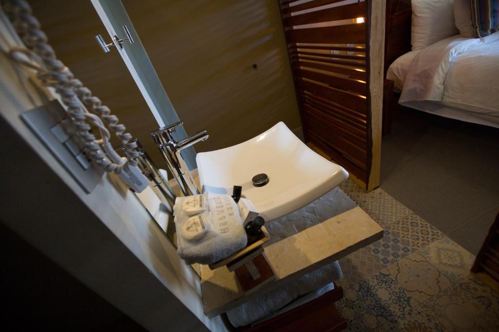 Postel nebo postele na pokoji v ubytování Hotel Helverica