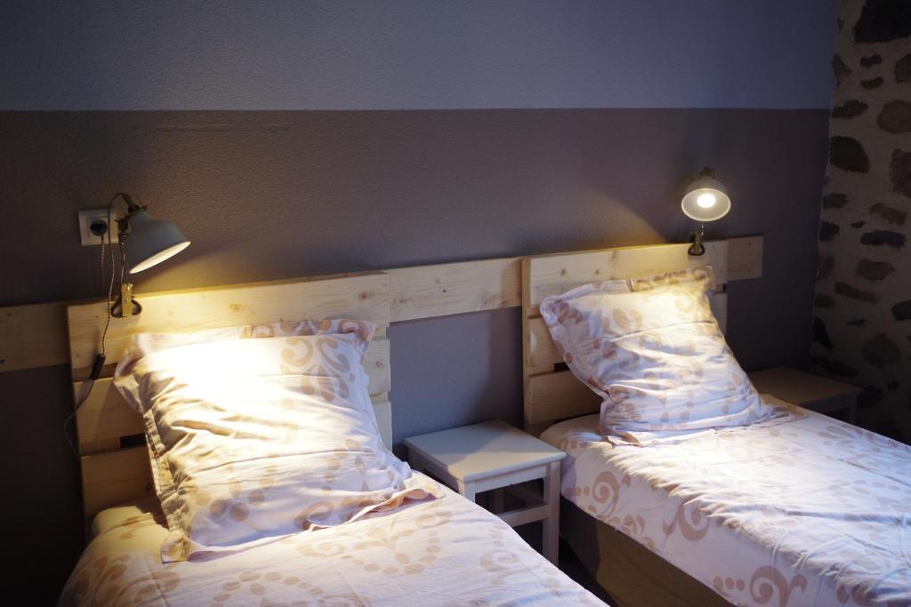 Postel nebo postele na pokoji v ubytování Le Grand Gîte