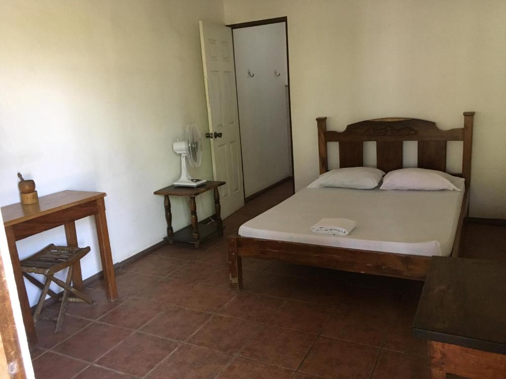 Postel nebo postele na pokoji v ubytování Tiquisia Lodge