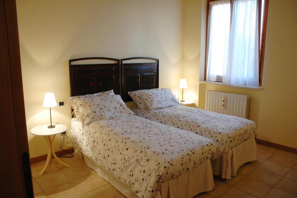 Postel nebo postele na pokoji v ubytování Agriturismo Al Barco
