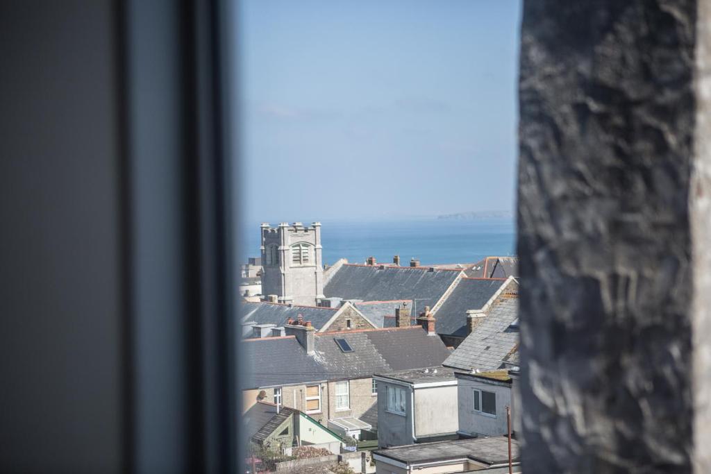 a view of a city from a window at St Breca in Newquay
