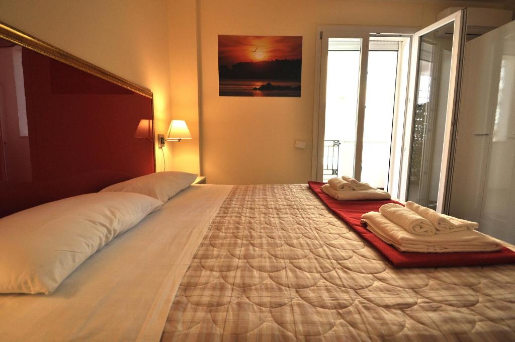 Postel nebo postele na pokoji v ubytování Felicity Residence