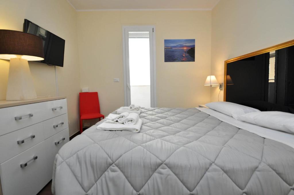 Postel nebo postele na pokoji v ubytování Felicity Residence
