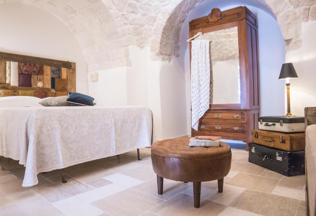 Posteľ alebo postele v izbe v ubytovaní Navolte Trulli e Quiete con Piscina