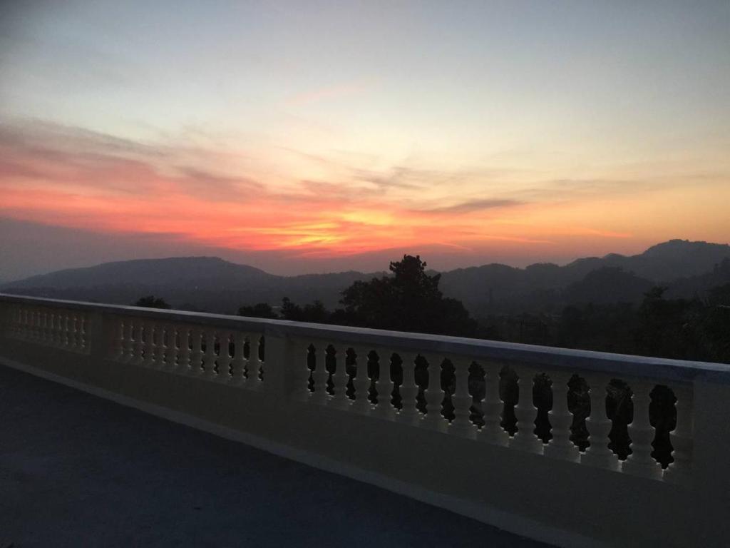 a view of a sunset from a bridge at Himalayan Villa in Dehradun
